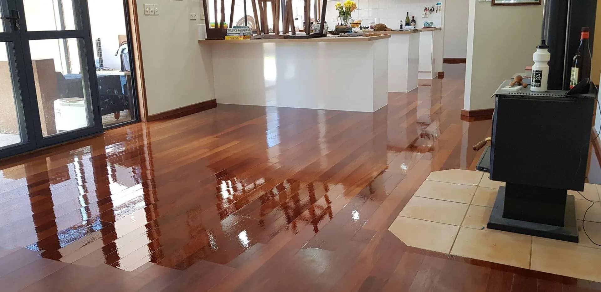 A Living Room With a Wooden Floor and a Fireplace  — NHM Painting & Projects Pty Ltd in Ciccone, NT