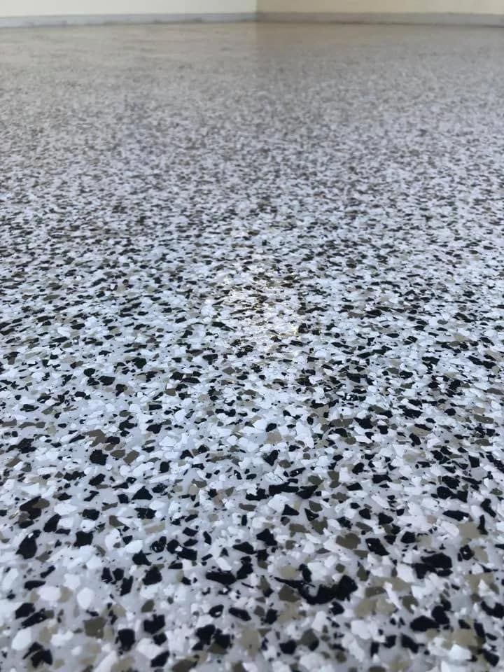 A Close Up of a Black and White Marble Floor in a Garage  — NHM Painting & Projects Pty Ltd in Ciccone, NT