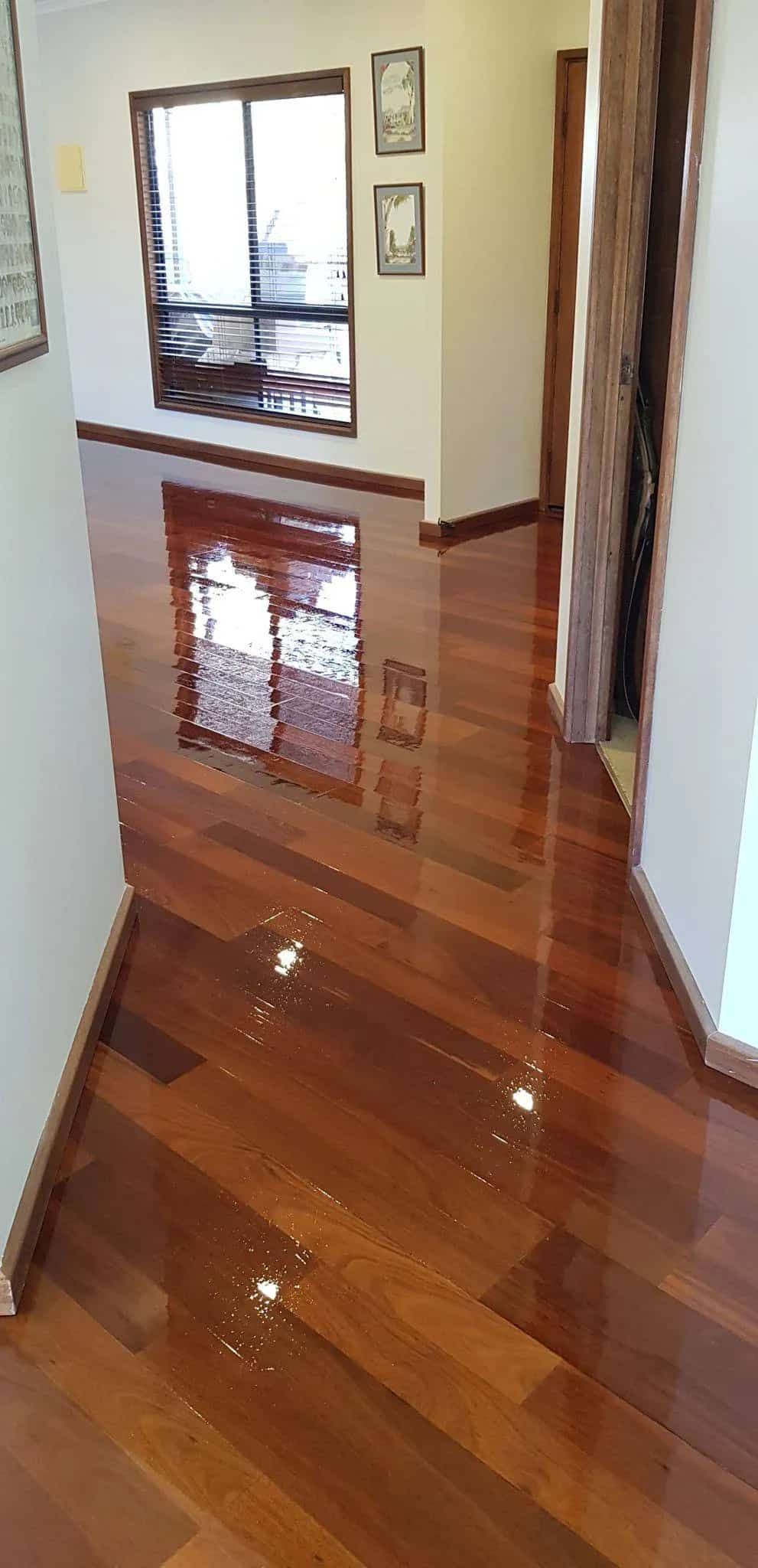 A Hallway With a Wooden Floor and a Mirror  — NHM Painting & Projects Pty Ltd in Ciccone, NT