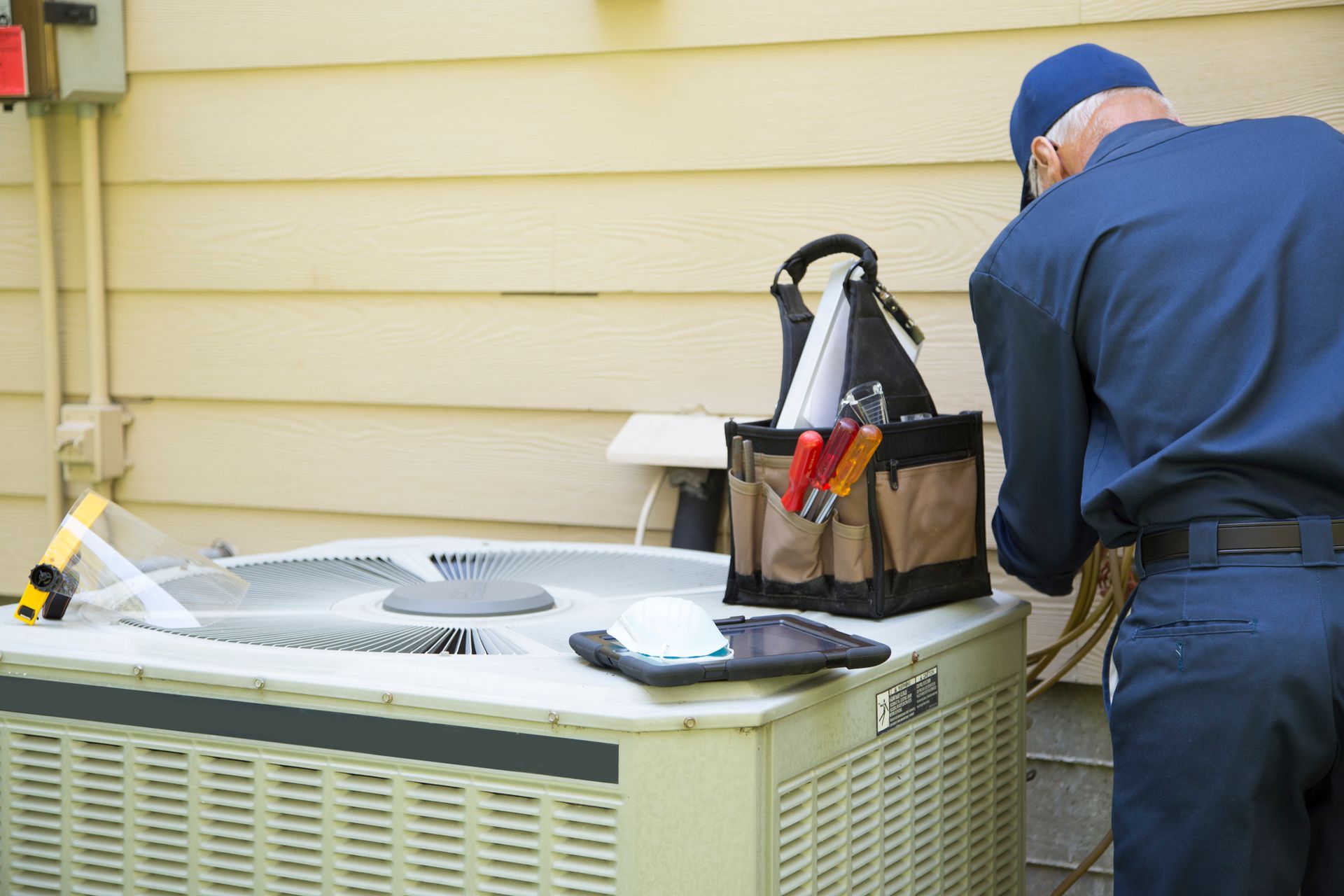 Technician Checking — Amherst, OH — Energy 1 Heating & Air Conditioning