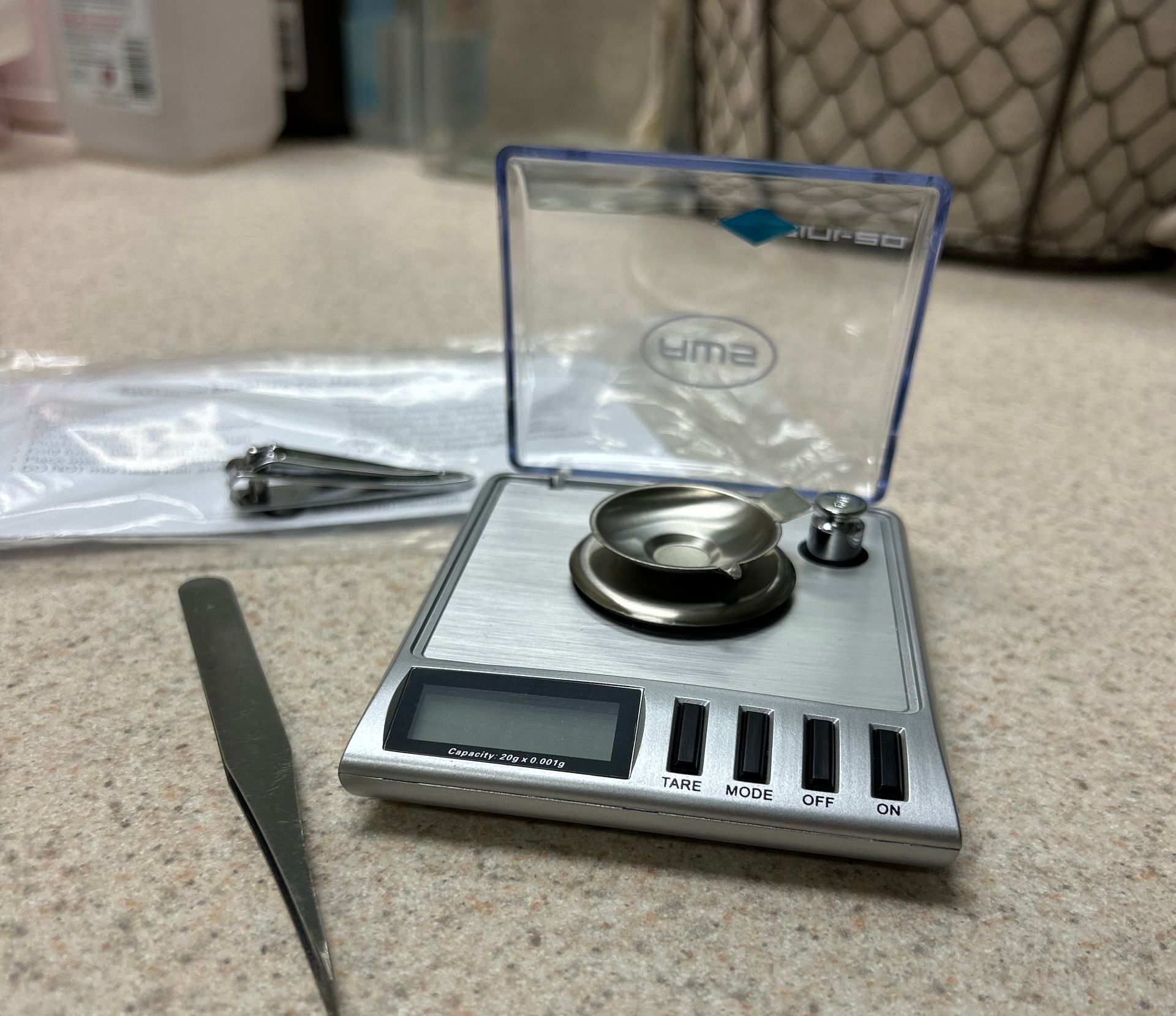 woman clipping her fingernail for a drug test