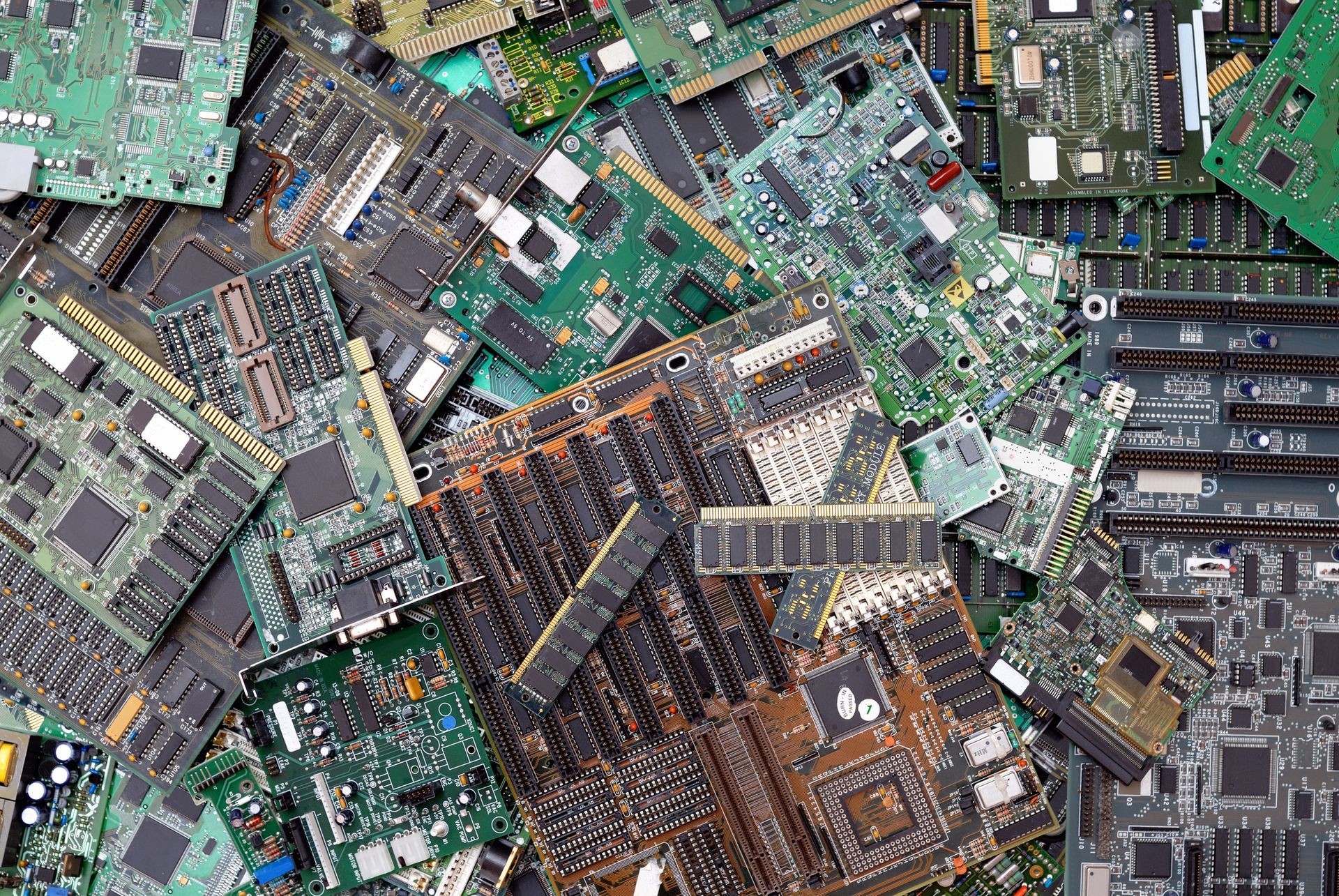 ITAD about to be recycled. Top view of a mass of computer circuit boards.