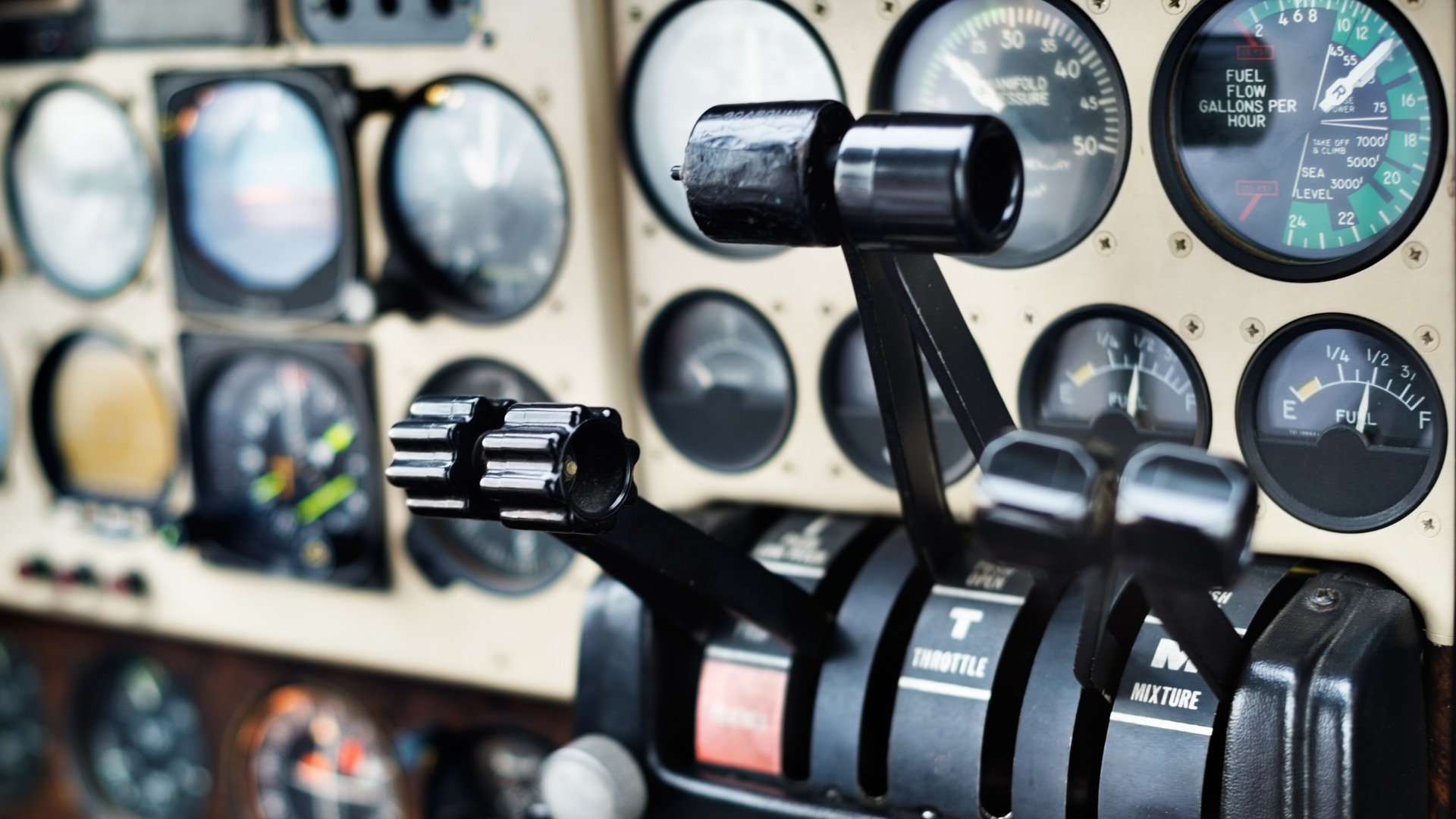 Airplane cockpit instruments and throttles.