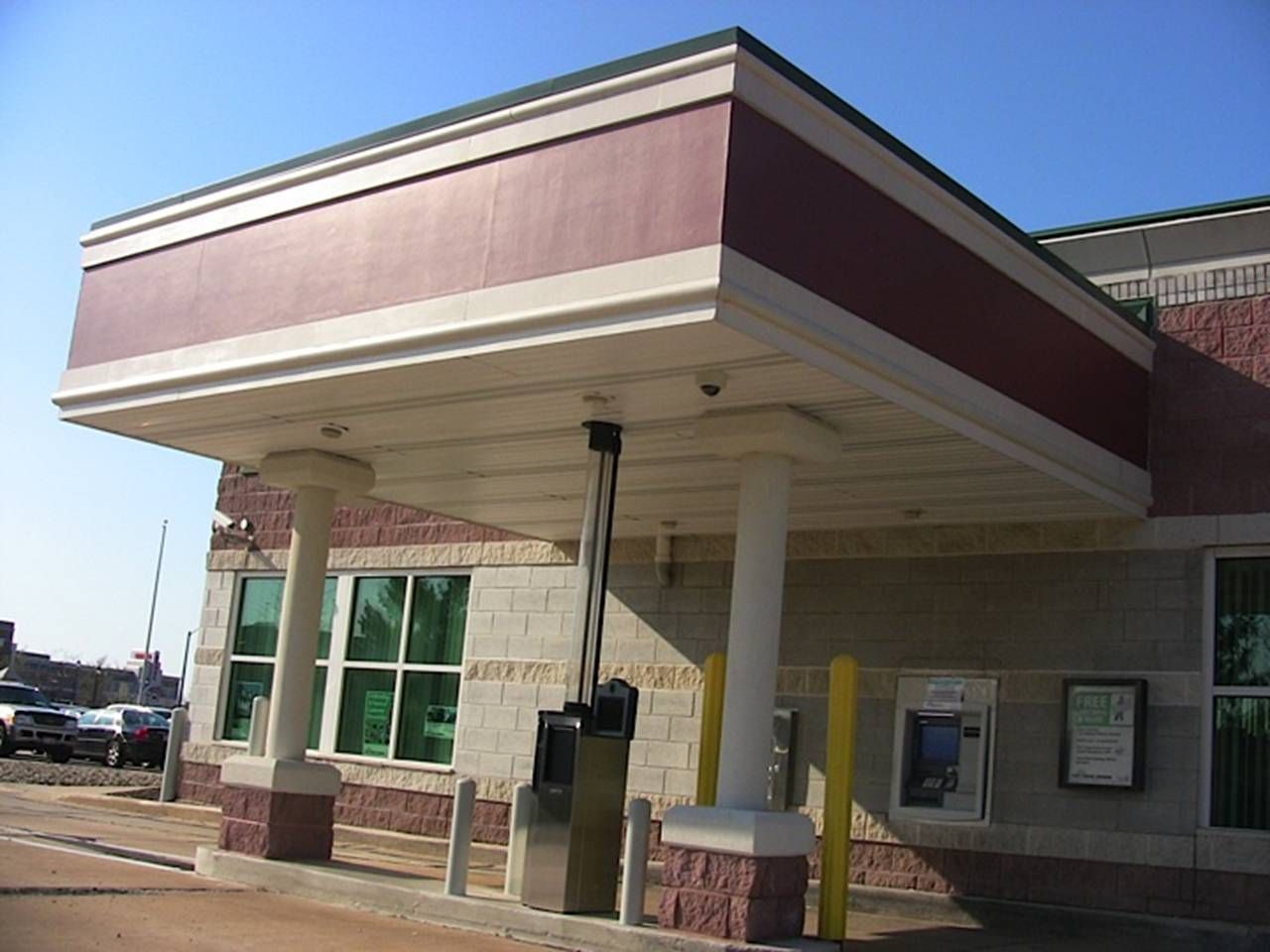 A brick building with a canopy over the entrance