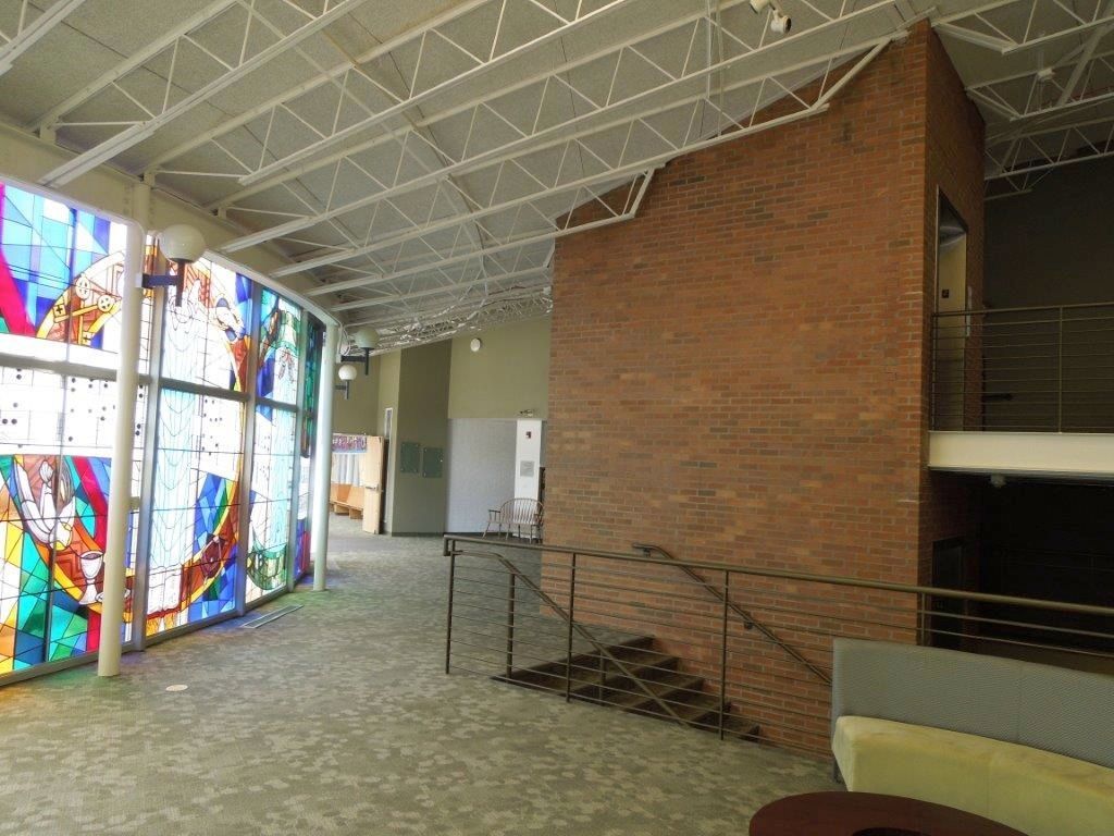 There is a stained glass window in the middle of the room.