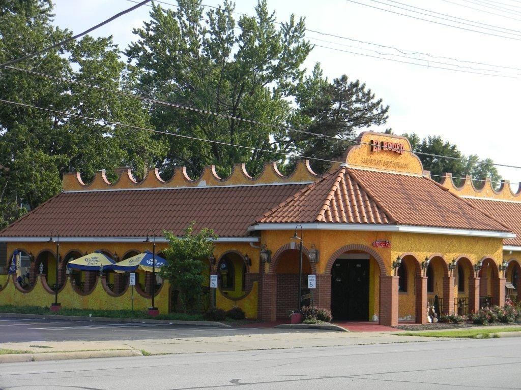 A mexican restaurant with a red tile roof