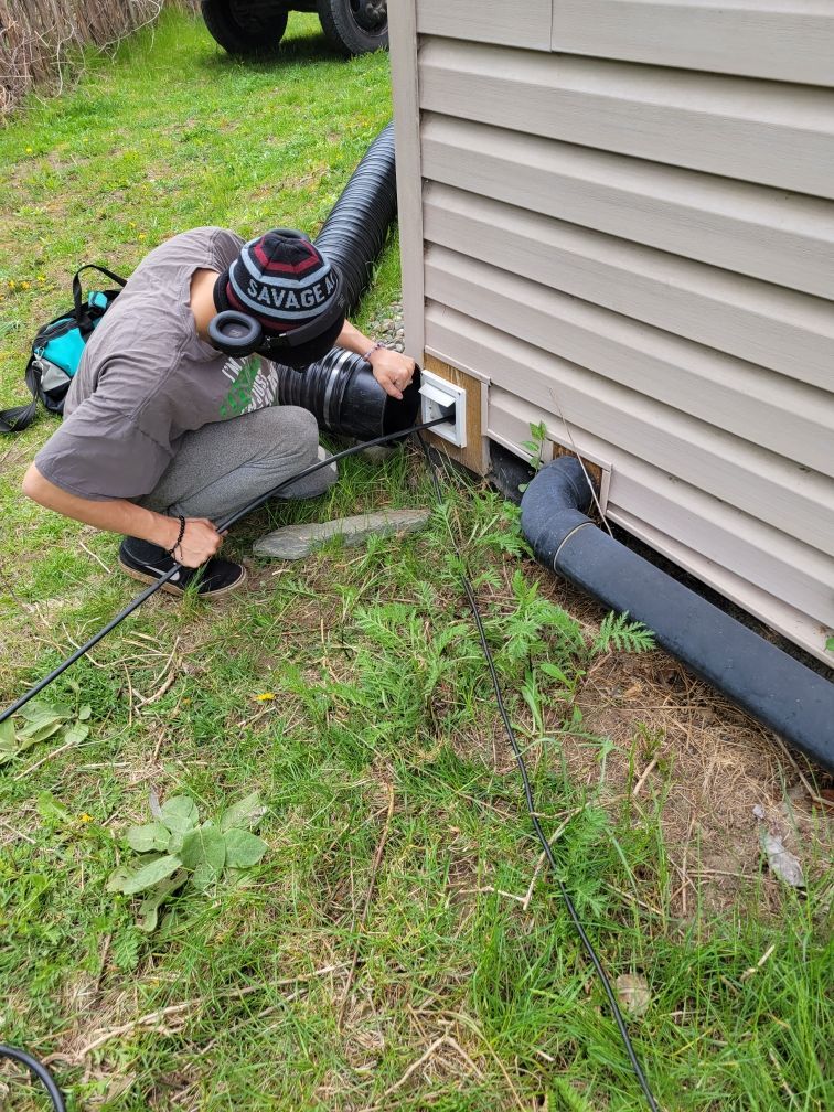 Man Cleaning The Vent — Sandpoint, ID — Indoor Air Care