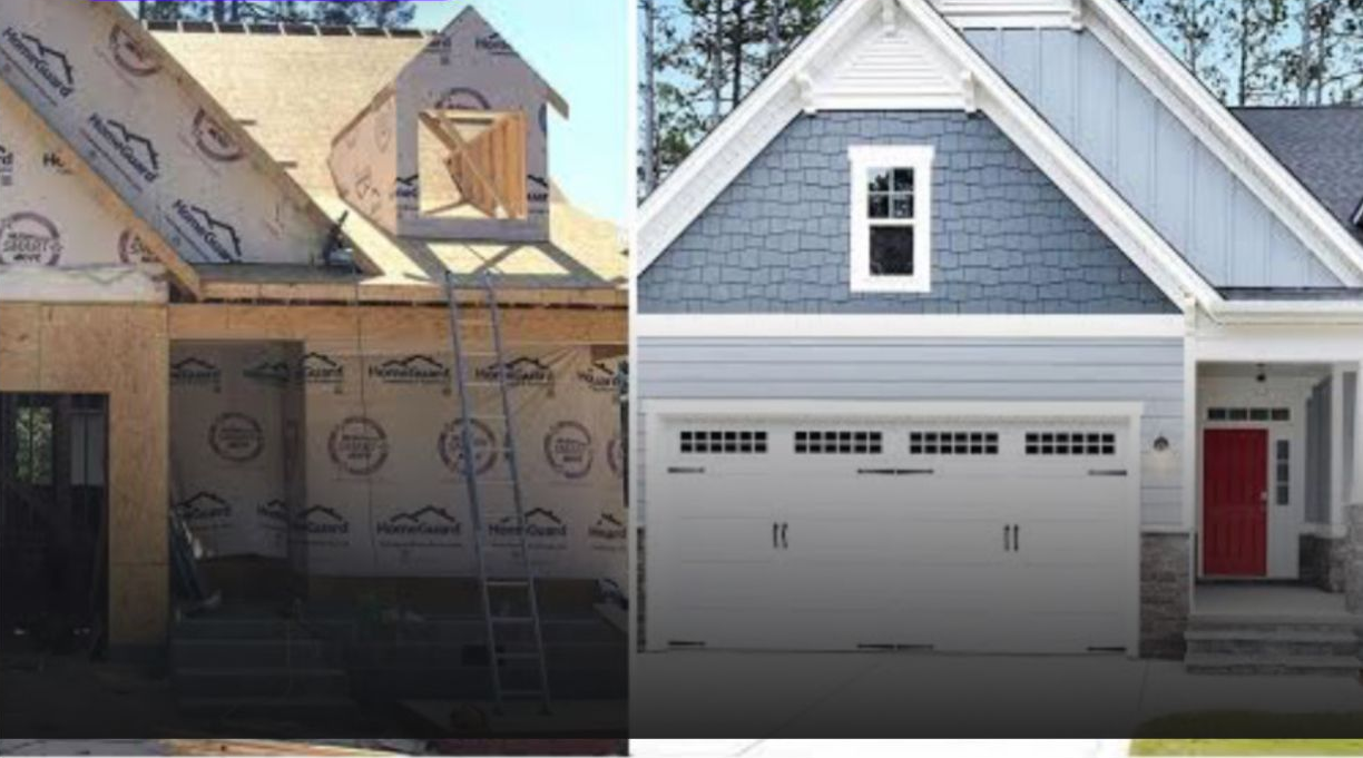 House under construction next to the finished house. Garage door, blue siding, red door.