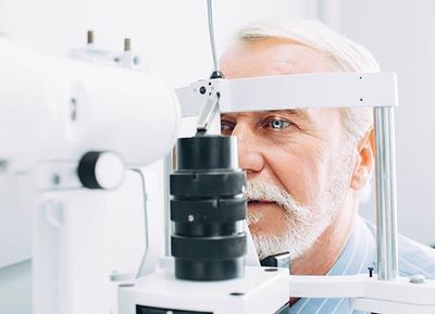 Eye Glasses — Senior Patient having Eye Exam in Thornton, CO