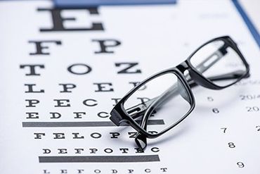 Vision Clinic — Eye Chart with Glasses in Thornton, CO