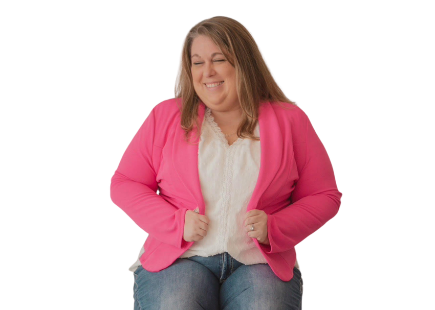 Kristen Latimer wearing a pink jacket and jeans is smiling