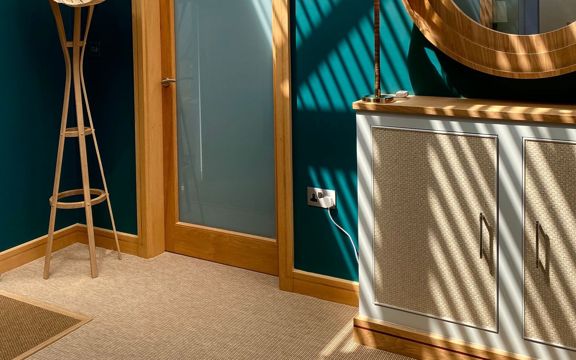 Teal hallway with unnatural flooring 
