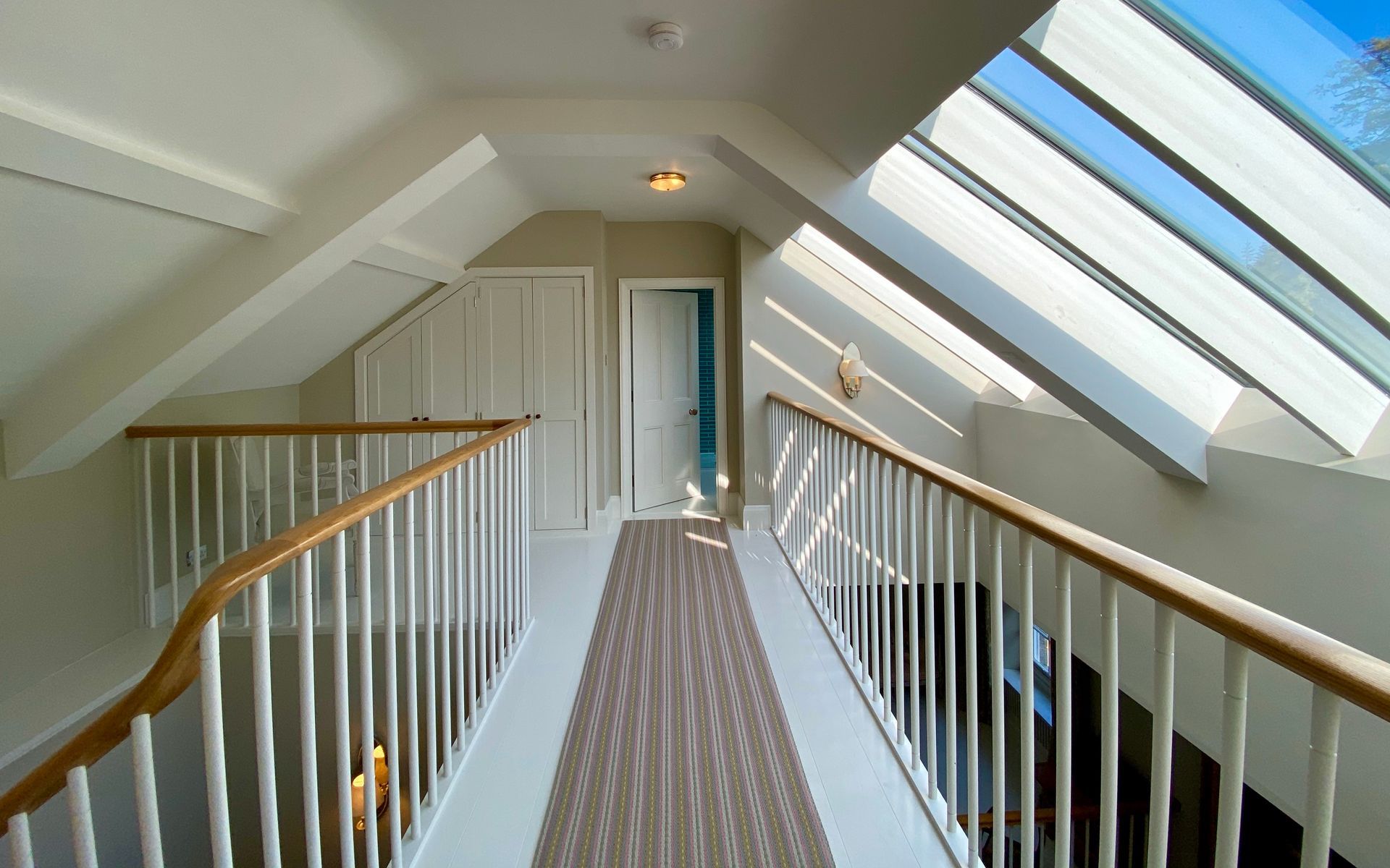 Roger Oates runner on floating landing in modern renovation project