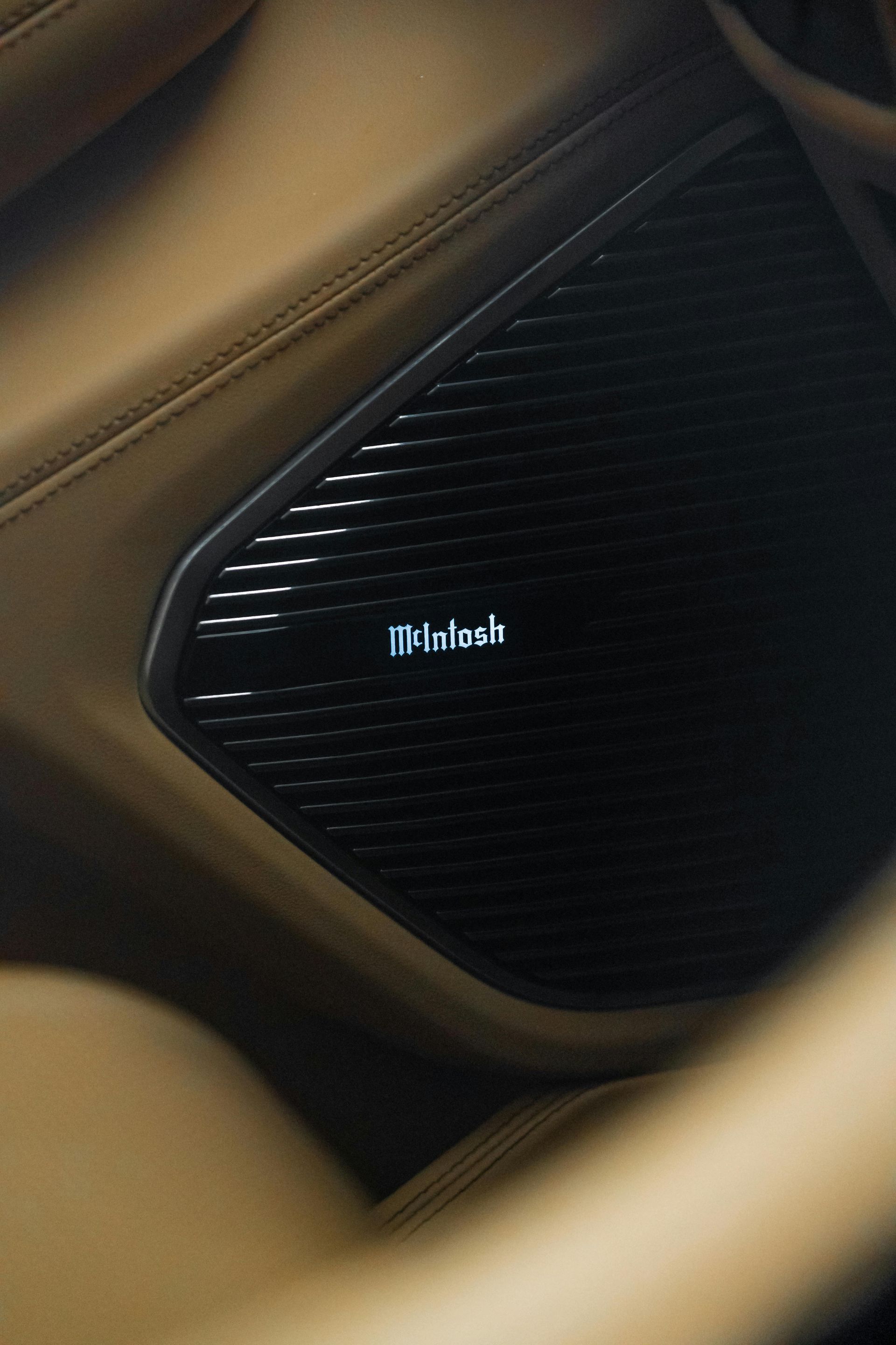 Close-up of a car speaker grille with the Focal logo, framed by beige trim.