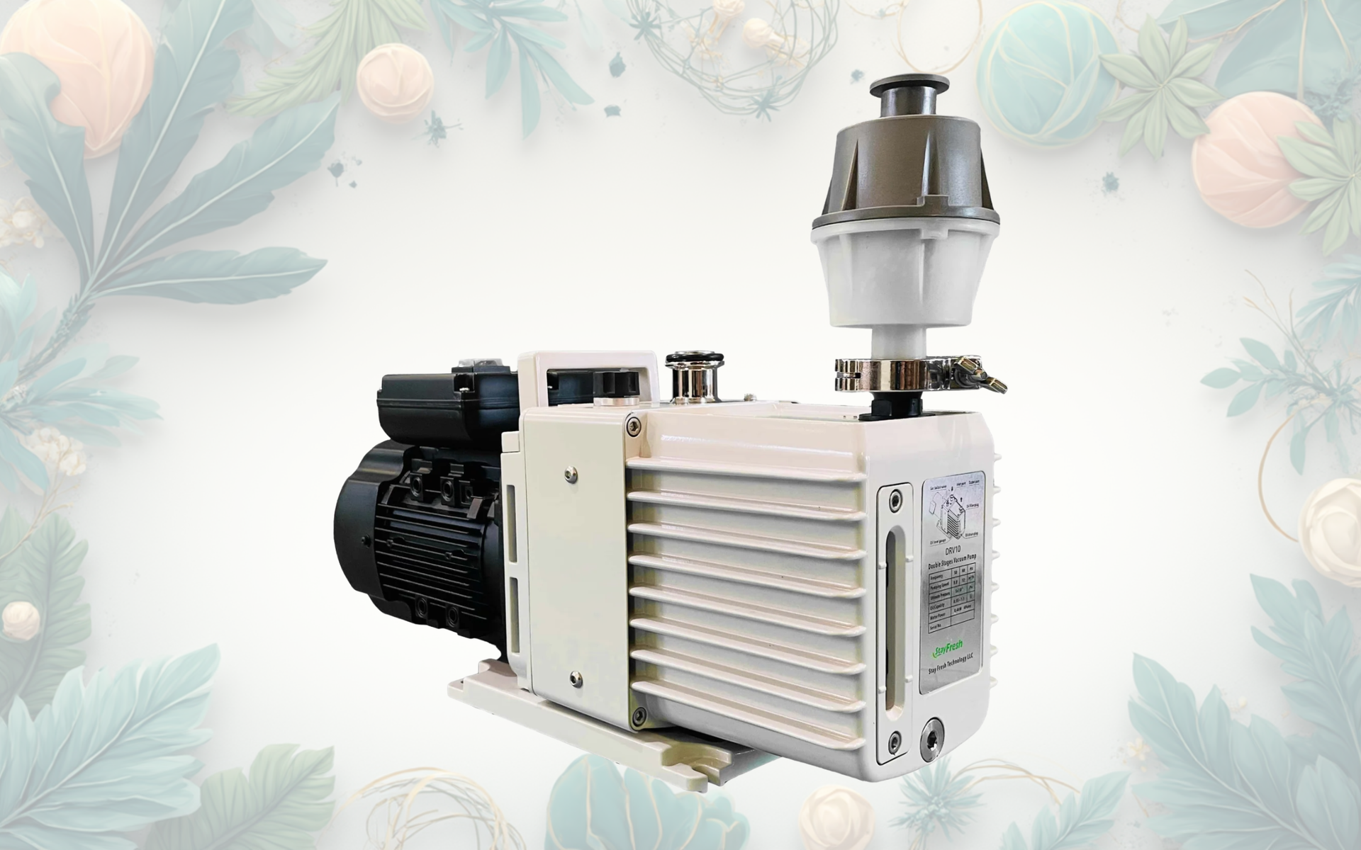 Vacuum pump, white and black, with a filter, on a blurred floral background.