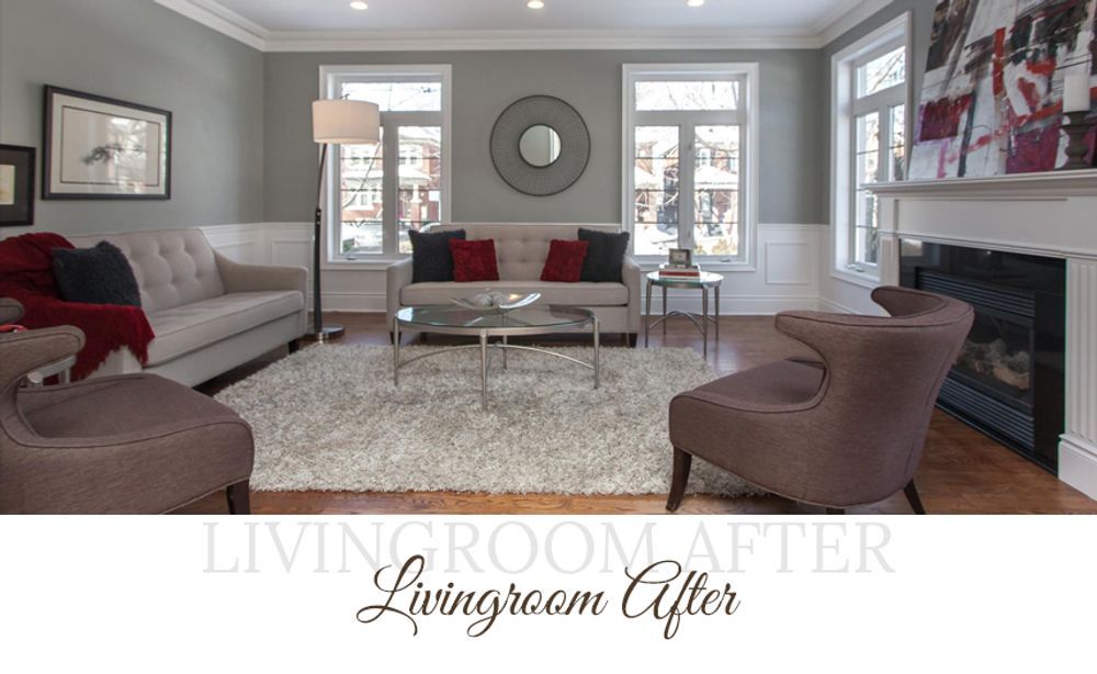 Living room with gray walls, beige couch, red and black pillows, and two brown chairs.
