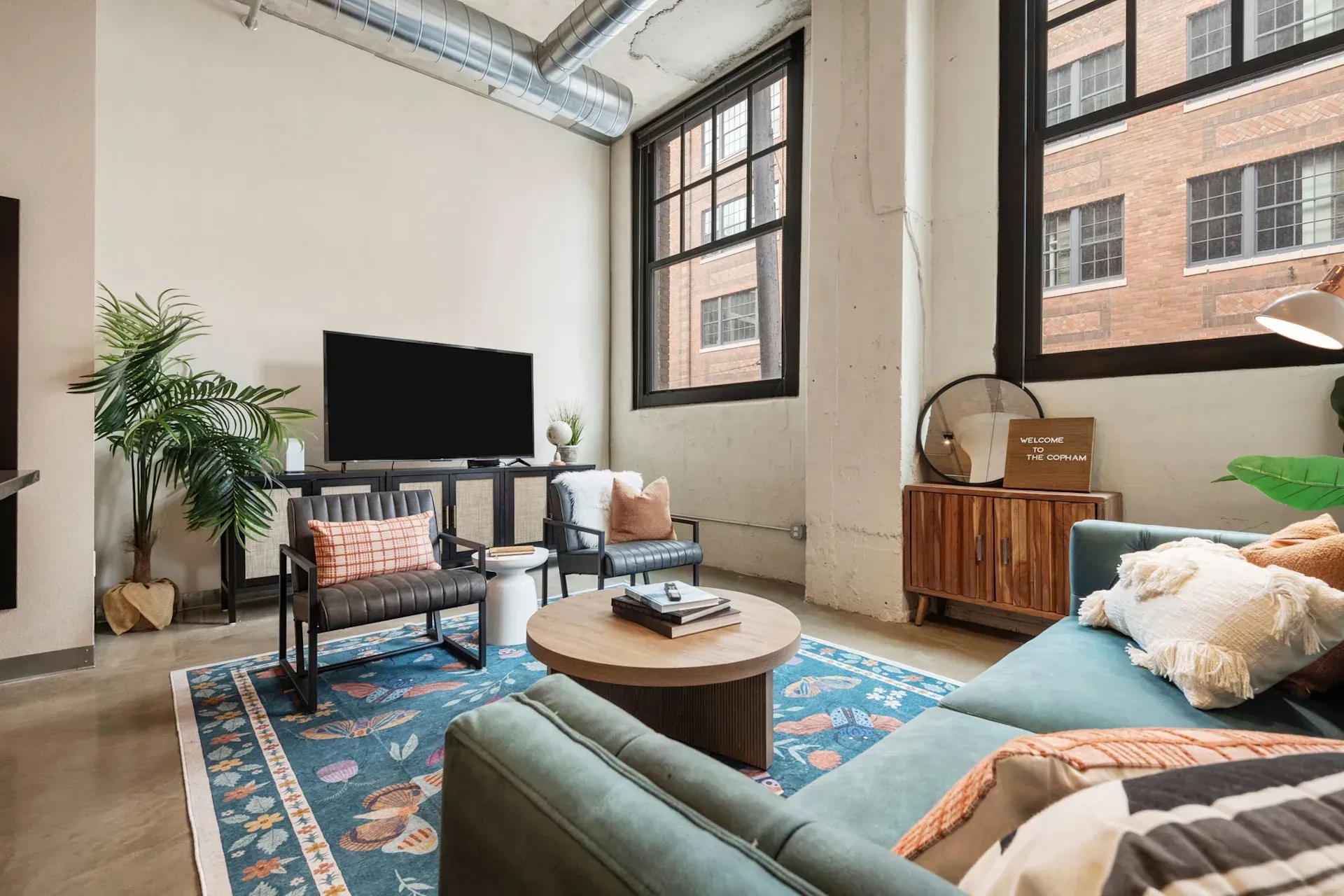 Apartments feature exposed brickwork and large windows that provide natural light