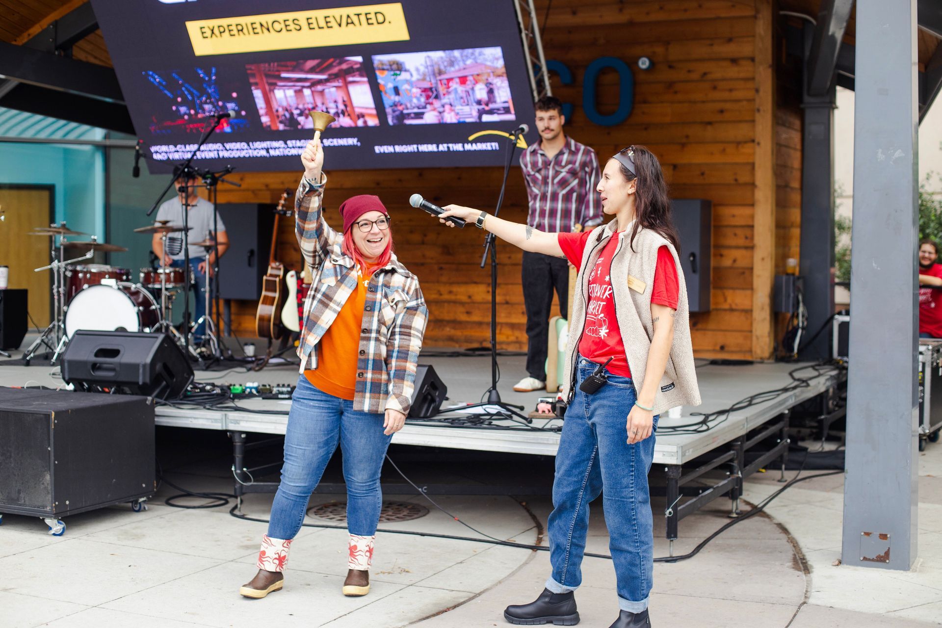 Kayla rings the bell at the Red River Market in Downtown Fargo