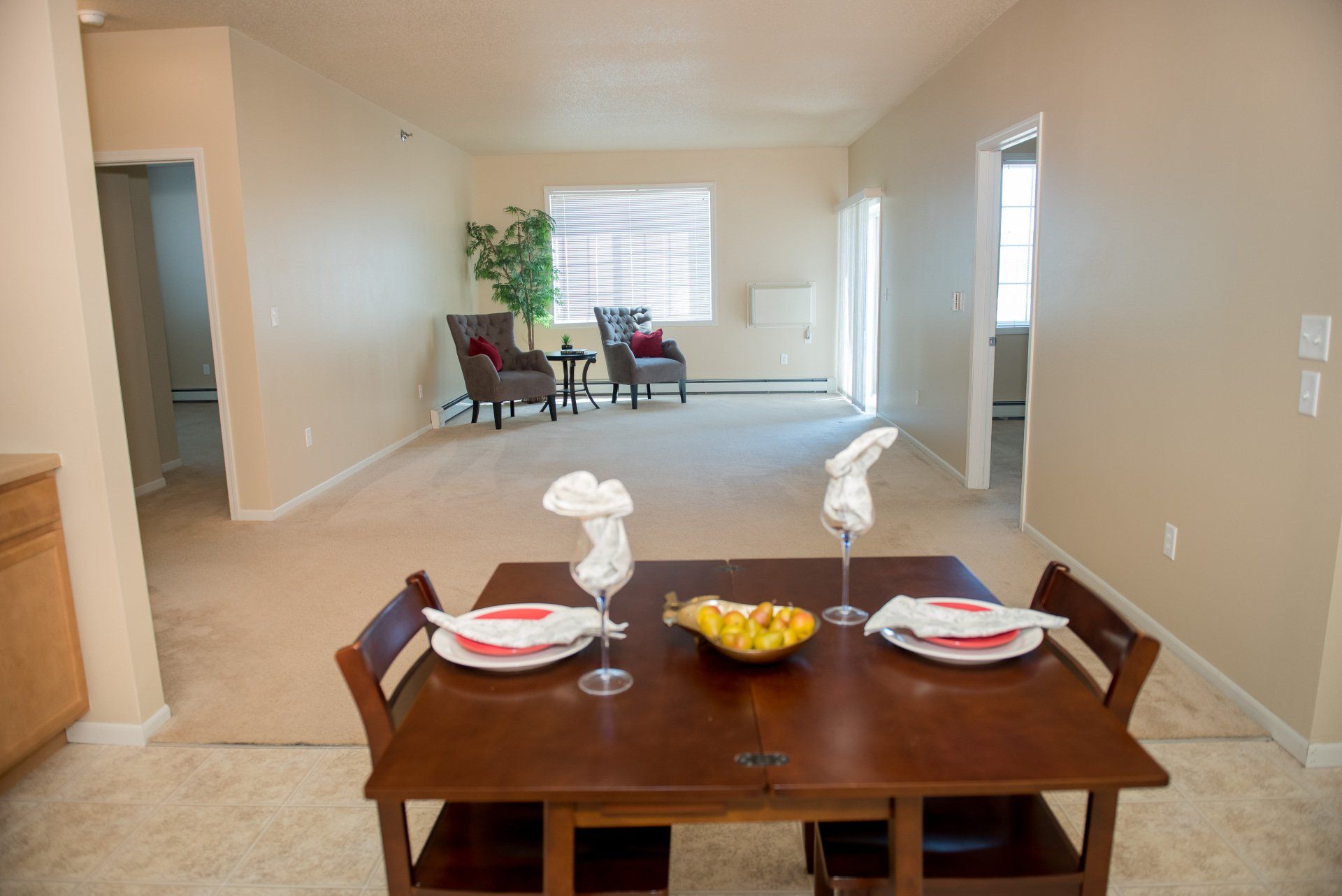 Dining room table and living room with large window