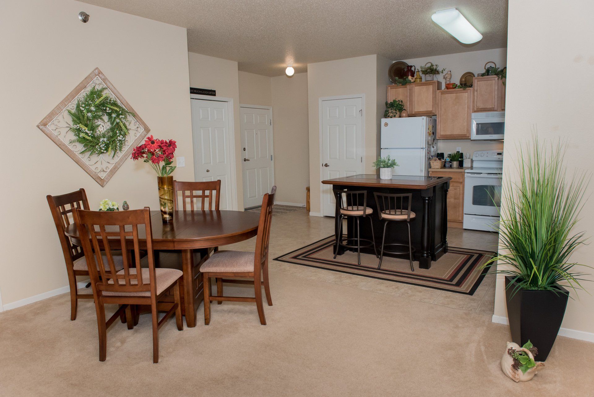 dining room with wooden table and house plant adjacent