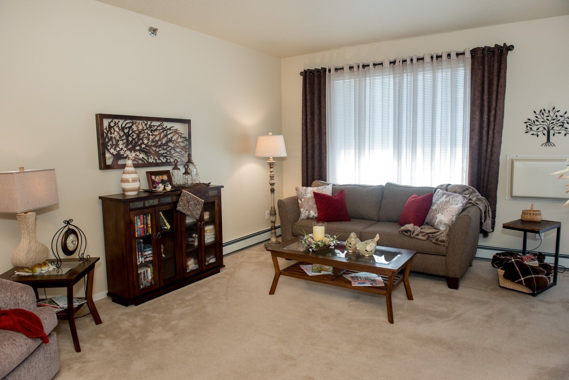 Alternate view of carpeted living room with large window