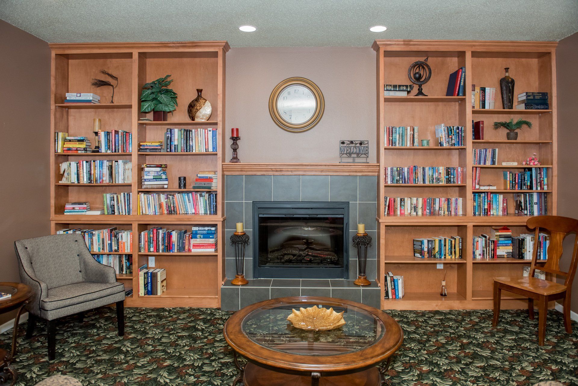Forward view of bookshelves and fireplace