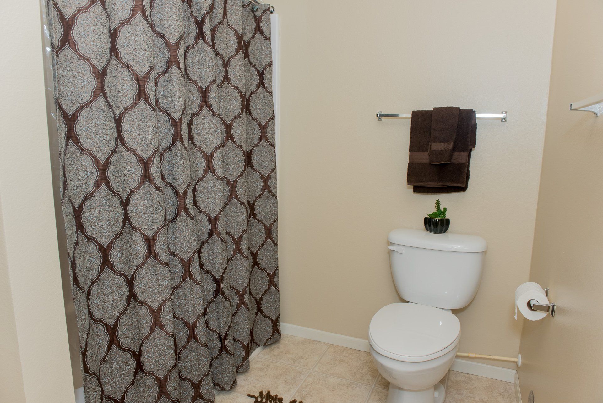 Interior view of bathroom with tub shower combo