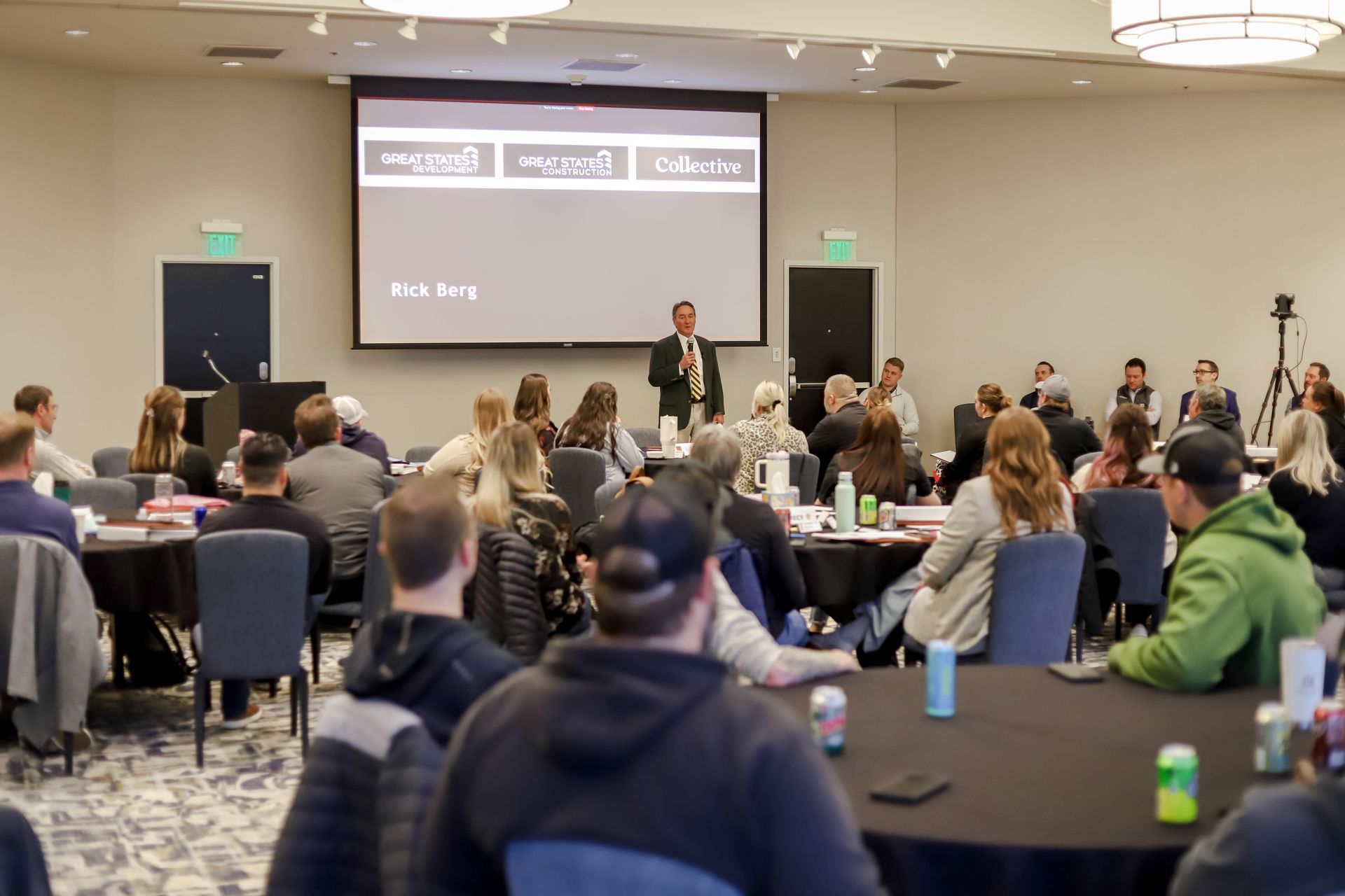Founder Rick Berg addresses co-workers from Collective and Great States Construction