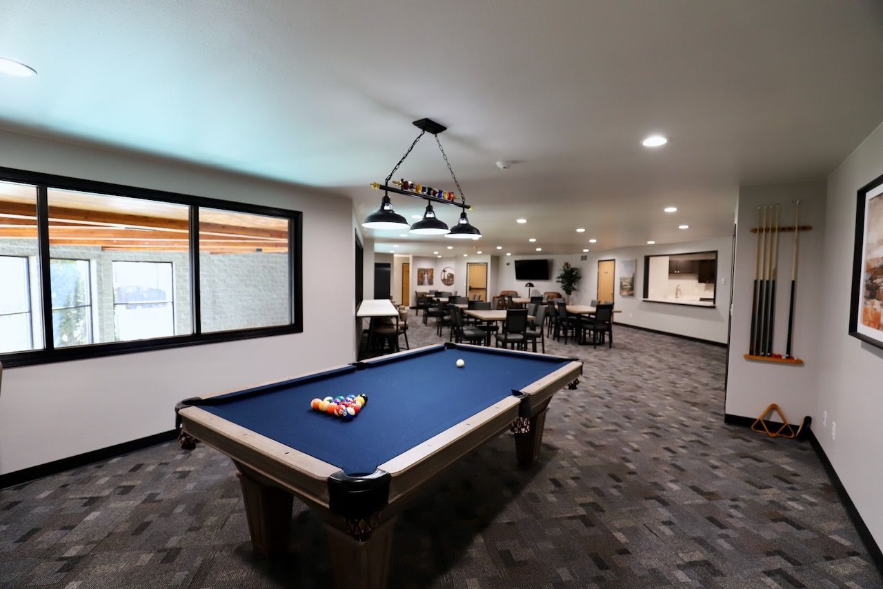 A new pool table in the updated community room at Dakota Park