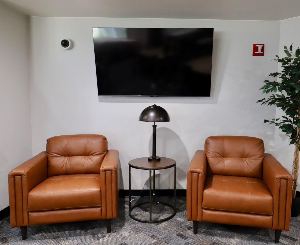 Updated seating and TVs in the Community Room at Dakota Park
