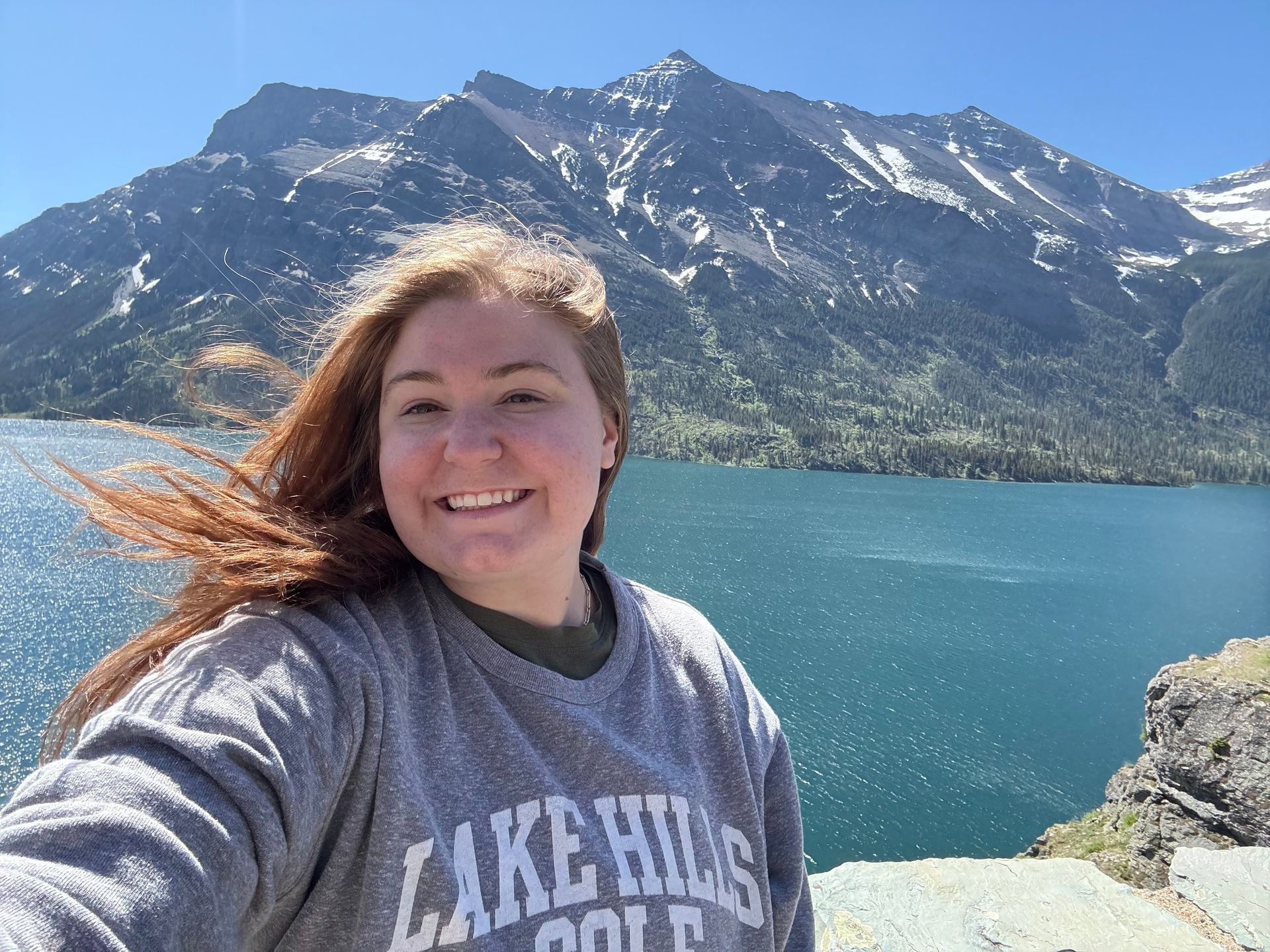 Tori Madilia with mountains and a lake in the background