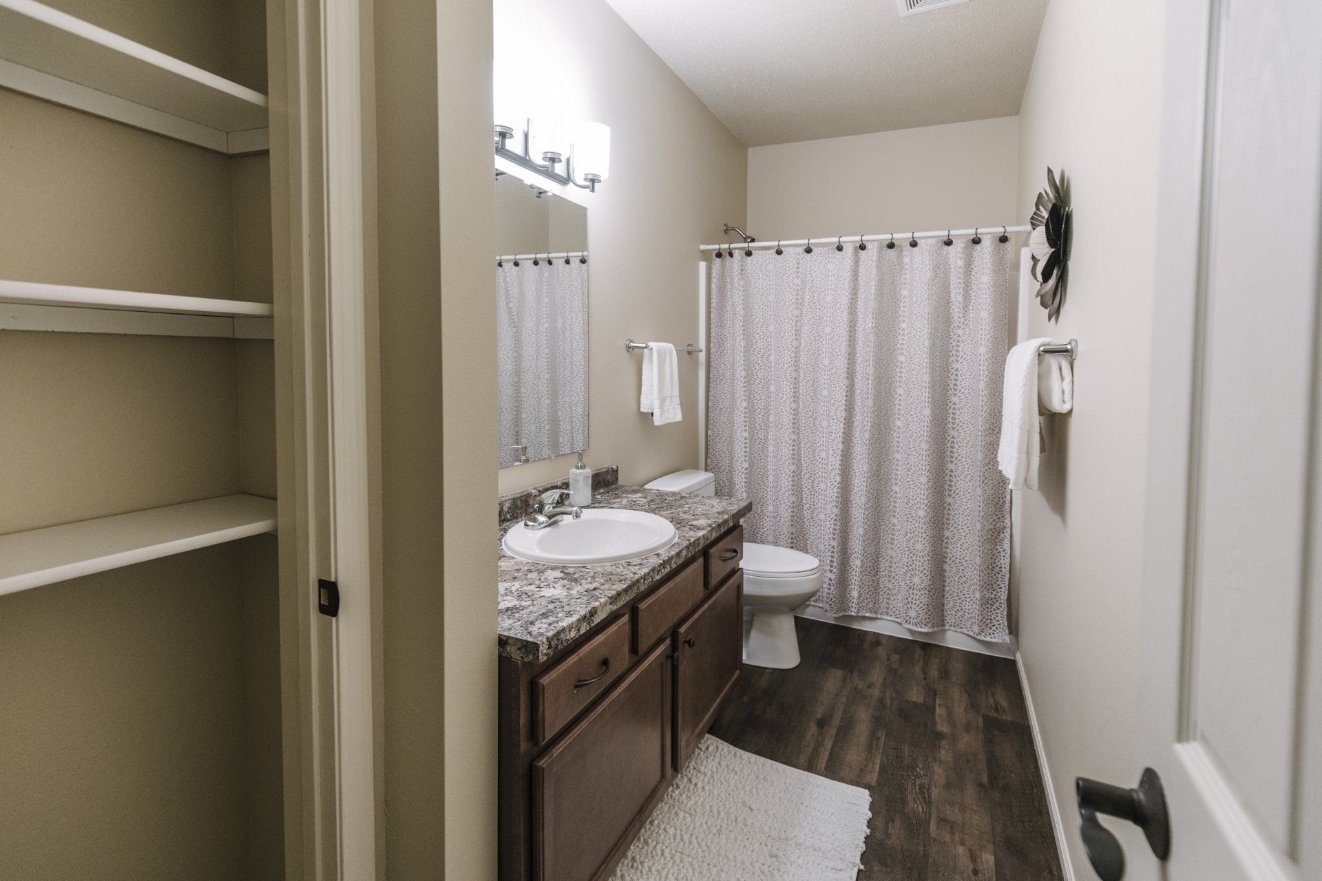 Alternate view of bathroom entryway with shower tub combo