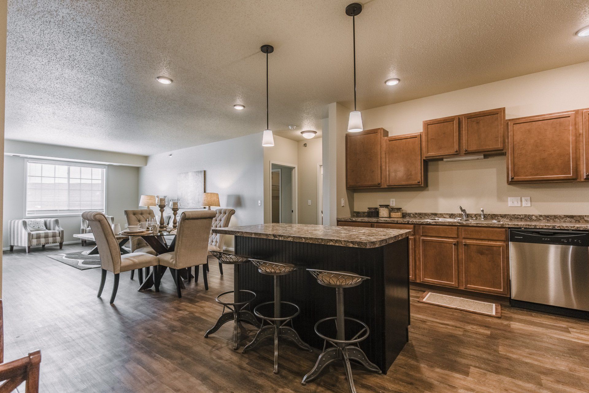 Kitchen with granite counter island and stainless steel appliances