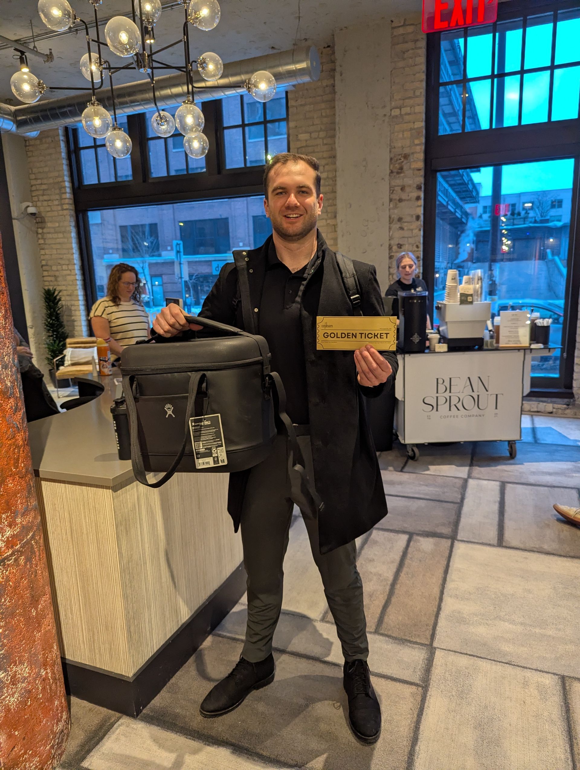 Resident of The Copham holds his winning Golden Ticket