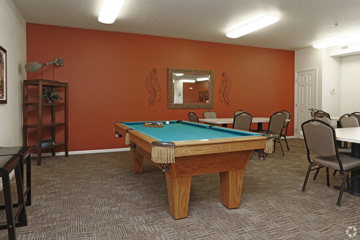 Community room featuring a pool table at Whispering Creek I