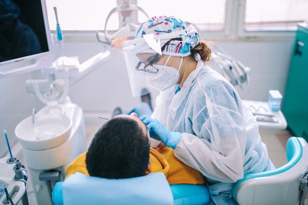 Dentist Checking up Patient Teeth — Andover, MN — Round Lake Dental