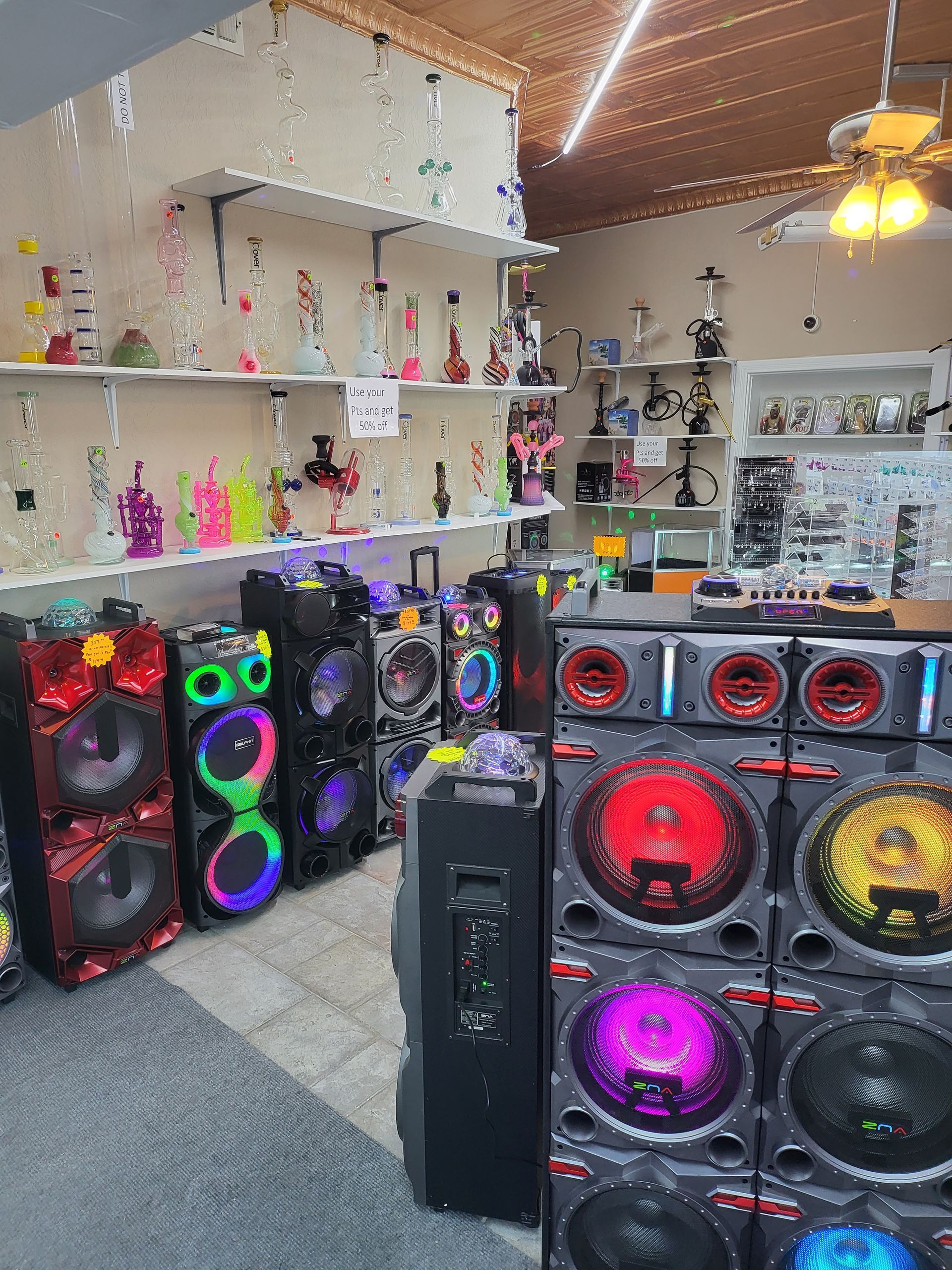 A room filled with lots of speakers and hookahs.