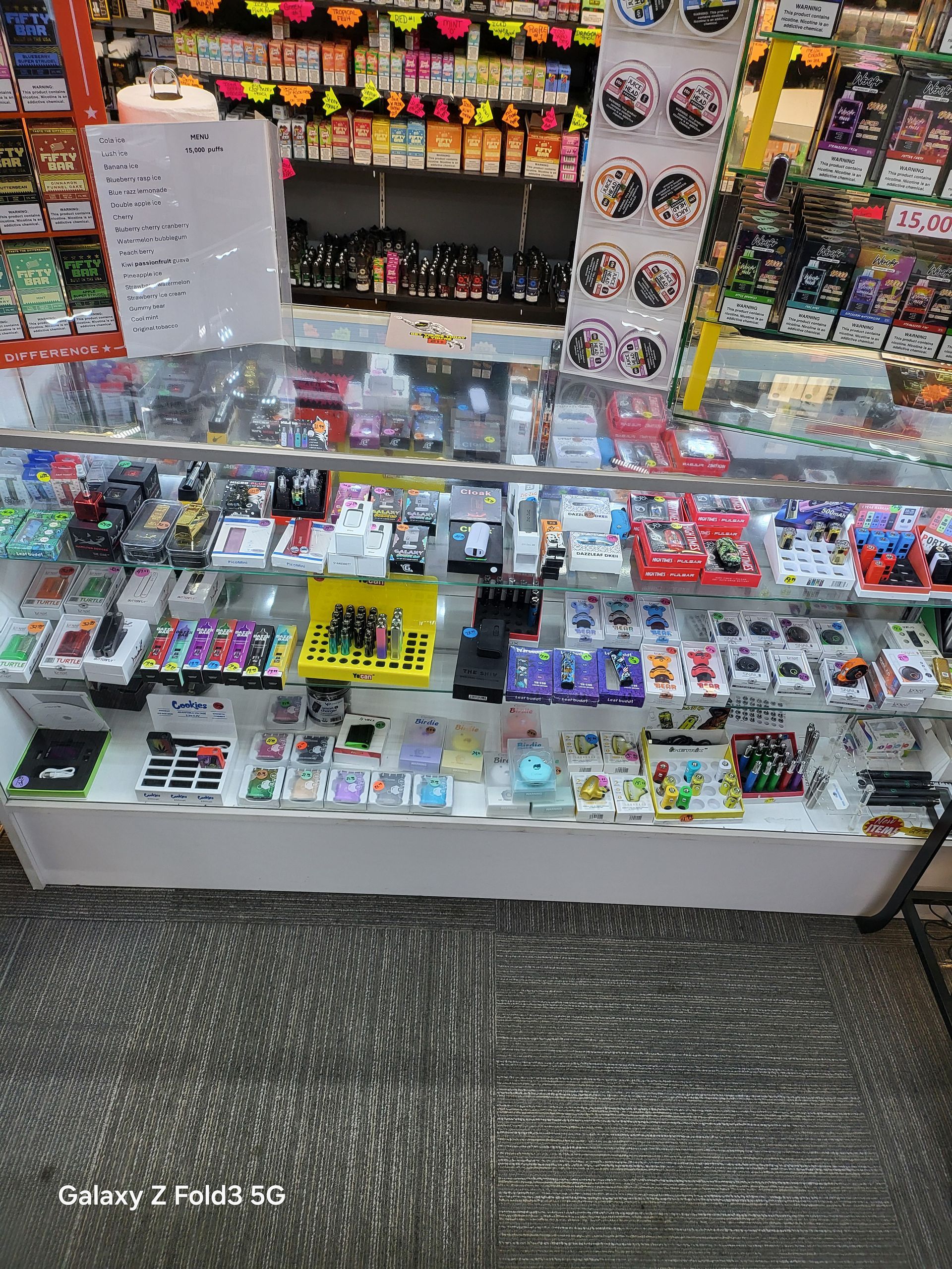 A display case filled with lots of items in a store.