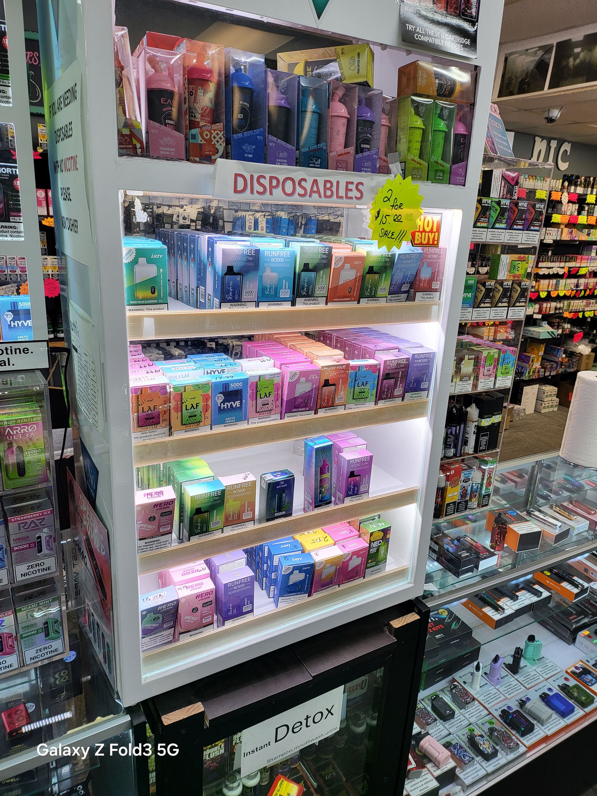 A display case filled with lots of disposables in a store.