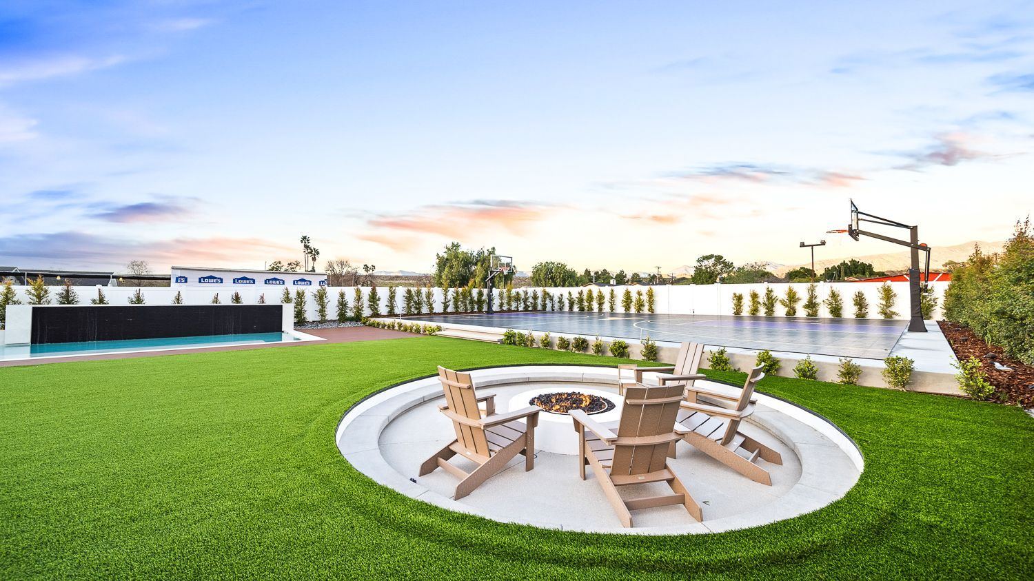 Custom pool and outdoor living project complete with a full court basketball court and outdoor kitchen. Project by Westmod. Location = Santa Clarita, CA.