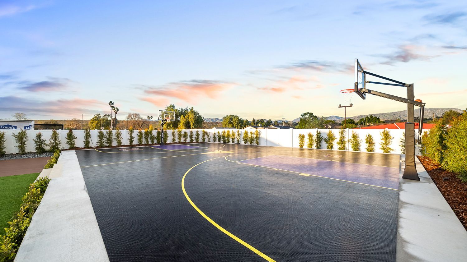 Custom pool and outdoor living project complete with a full court basketball court and outdoor kitchen. Project by Westmod. Location = Santa Clarita, CA.