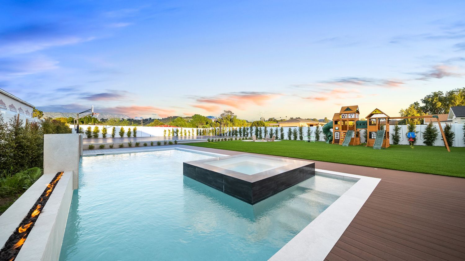 Custom pool and outdoor living project complete with a full court basketball court and outdoor kitchen. Project by Westmod. Location = Santa Clarita, CA.