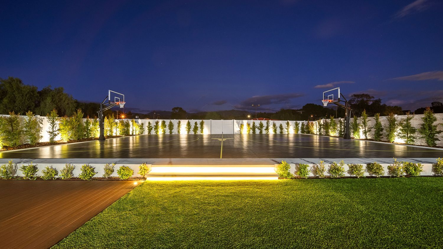 Custom pool and outdoor living project complete with a full court basketball court and outdoor kitchen. Project by Westmod. Location = Santa Clarita, CA.