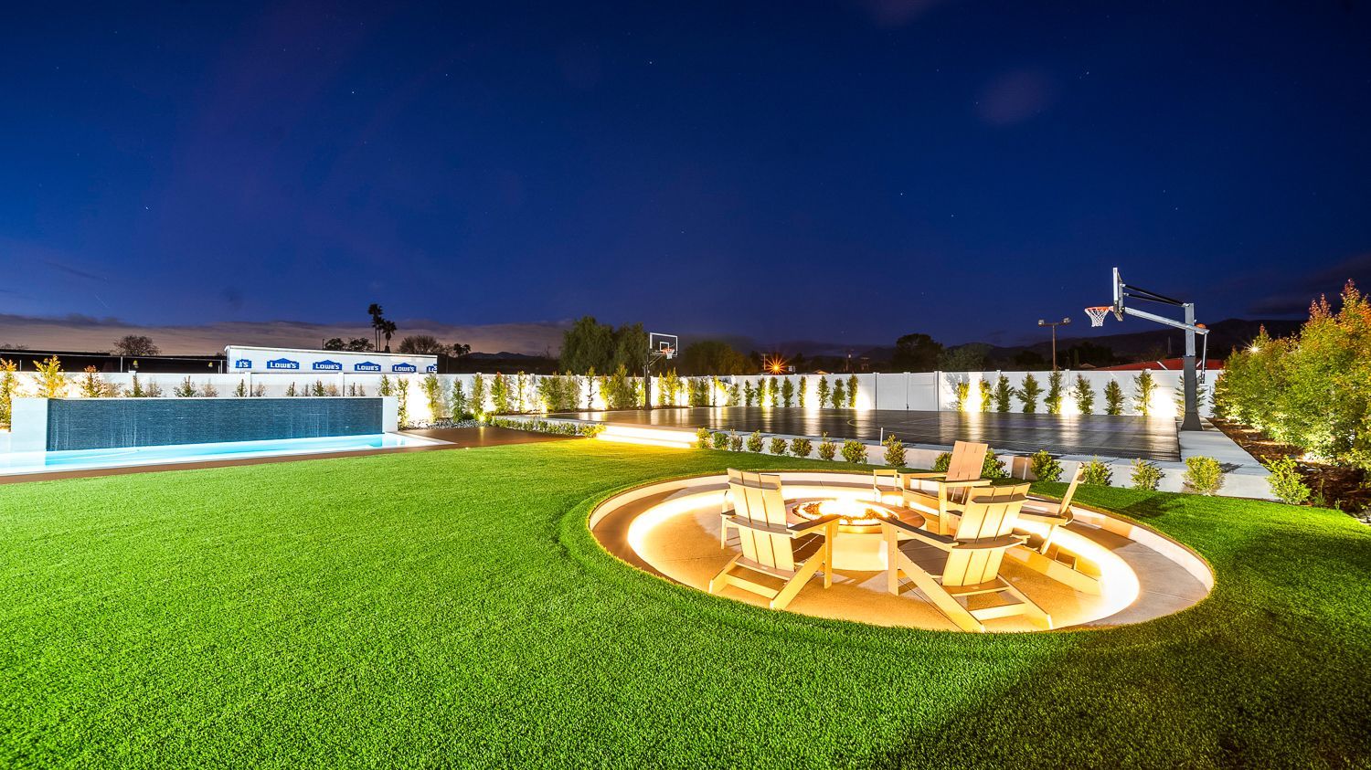 Custom pool and outdoor living project complete with a full court basketball court and outdoor kitchen. Project by Westmod. Location = Santa Clarita, CA.
