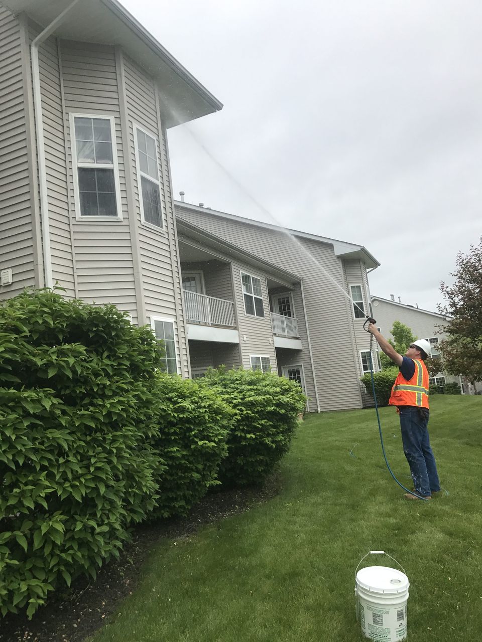 Man Cleaning The Side of A House- Lebanon, PA - Enviroman Services
