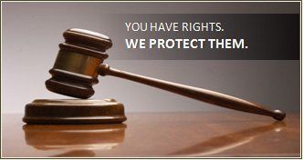 Gavel on a wooden table. Text: 