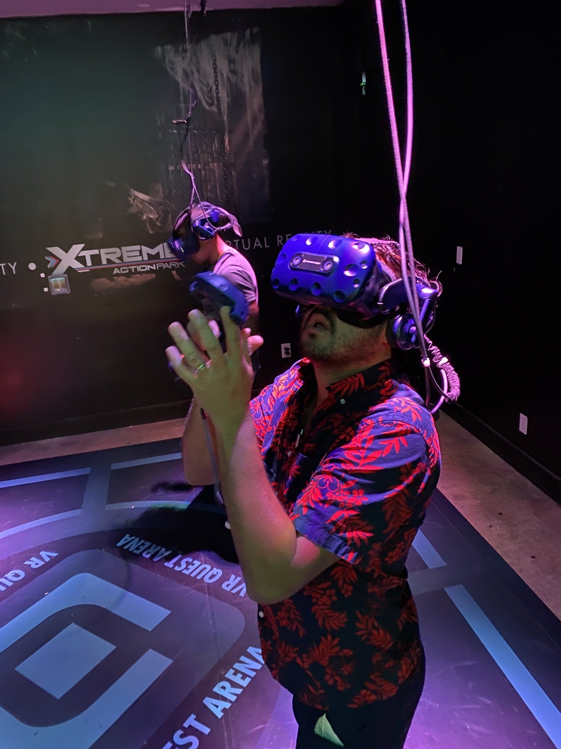 A man wearing a virtual reality headset in a dark room