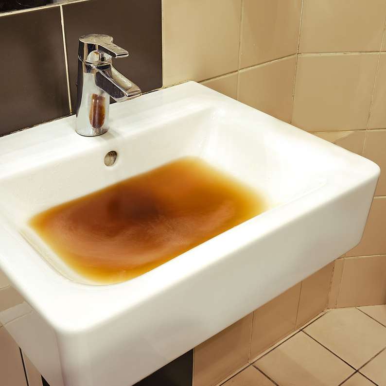 Sink With Dirty Water Due To Clogged Pipe