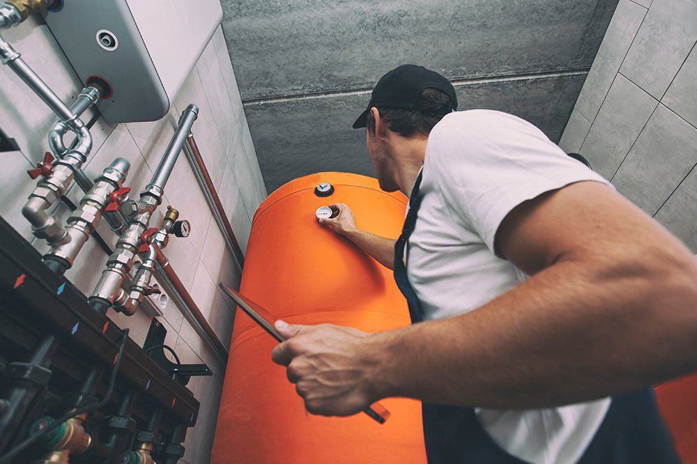 Man Checking The Water Heating System