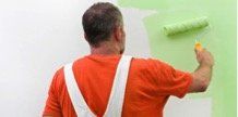 Guy painting a wall